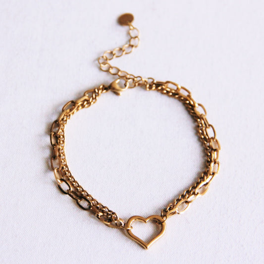 Dubbele schakelarmband met open hart - goud